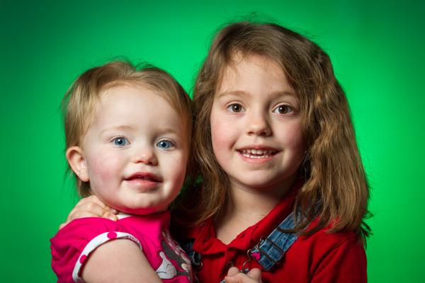 580EXII camera left at 45 degrees and 1/8 power in Cheetah 24" QBox softbox with circular insert. 430EXII at 1/16 power directly behind subject gelled with "Dark Green" gel from Rosco's gel kit. DIY 24" silver reflector camera right (little impact on photo). Flashes triggered with Yongnuo YN622Cs.
